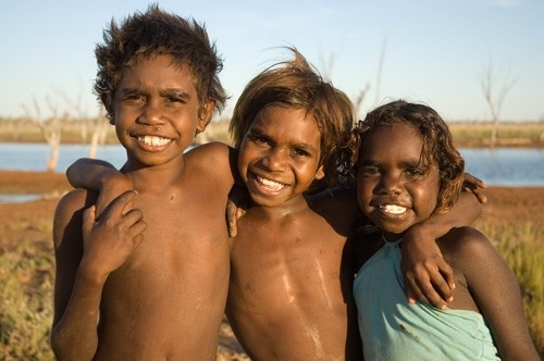 Head portrait of three young Aboriginal children from a remote community