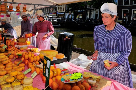 Woman selling Cheese at Alkmaar Cheese Market, North Holland, 