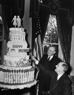 FDR Presidency. US President Franklin Delano Roosevelt admiring his birthday cake, circa late 1930s.