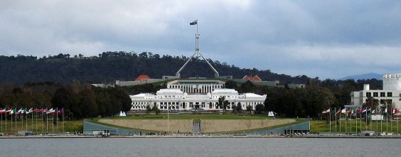 The old and behind it is the new parliament in Canberra