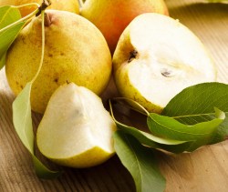 Ripe pears closeup on wooden table